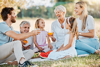 Buy stock photo Park picnic, laughing and family children, parents and grandparents drinking orange juice, nature and funny joke. Grass field, grandpa and relax senior grandma, father or mother bond with garden kids