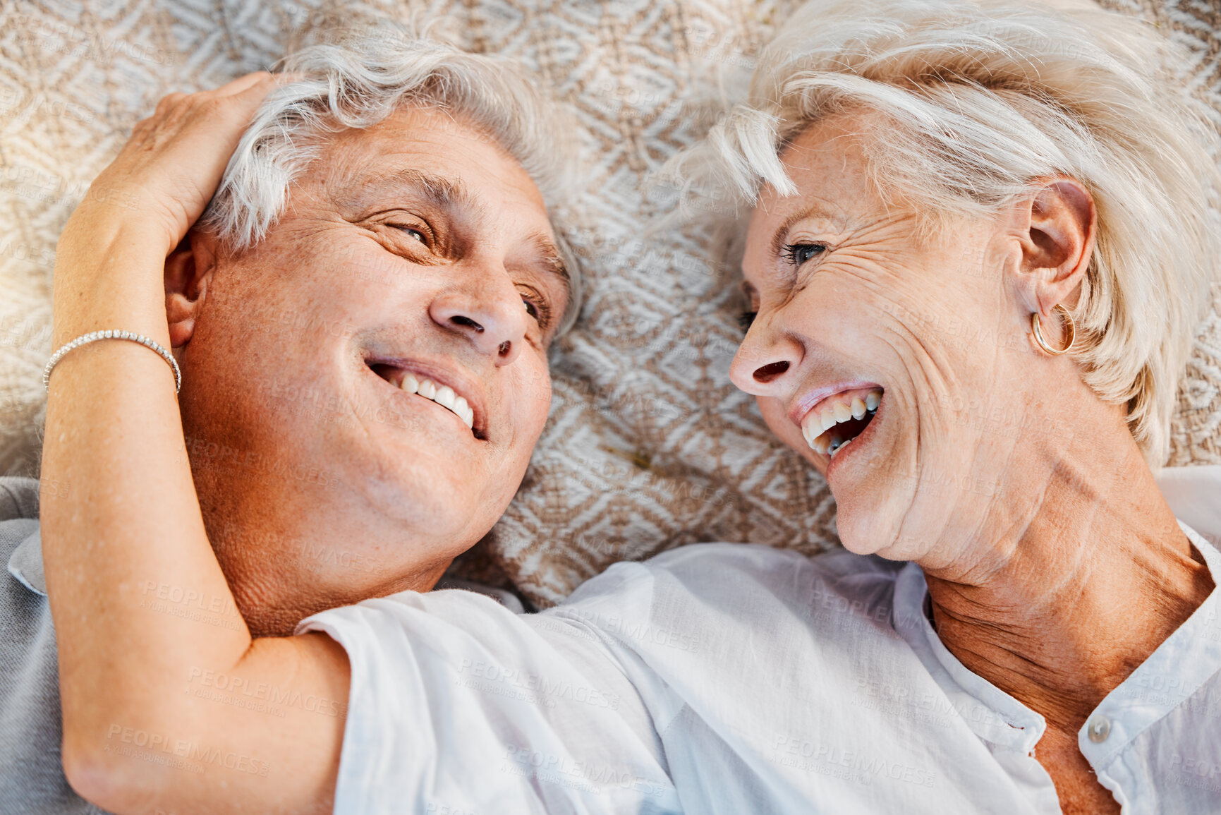 Buy stock photo Love, retirement and a senior couple from above, laughing at a funny joke together for happy romance. Comic, summer dating or affection with an elderly man and woman in the countryside to relax