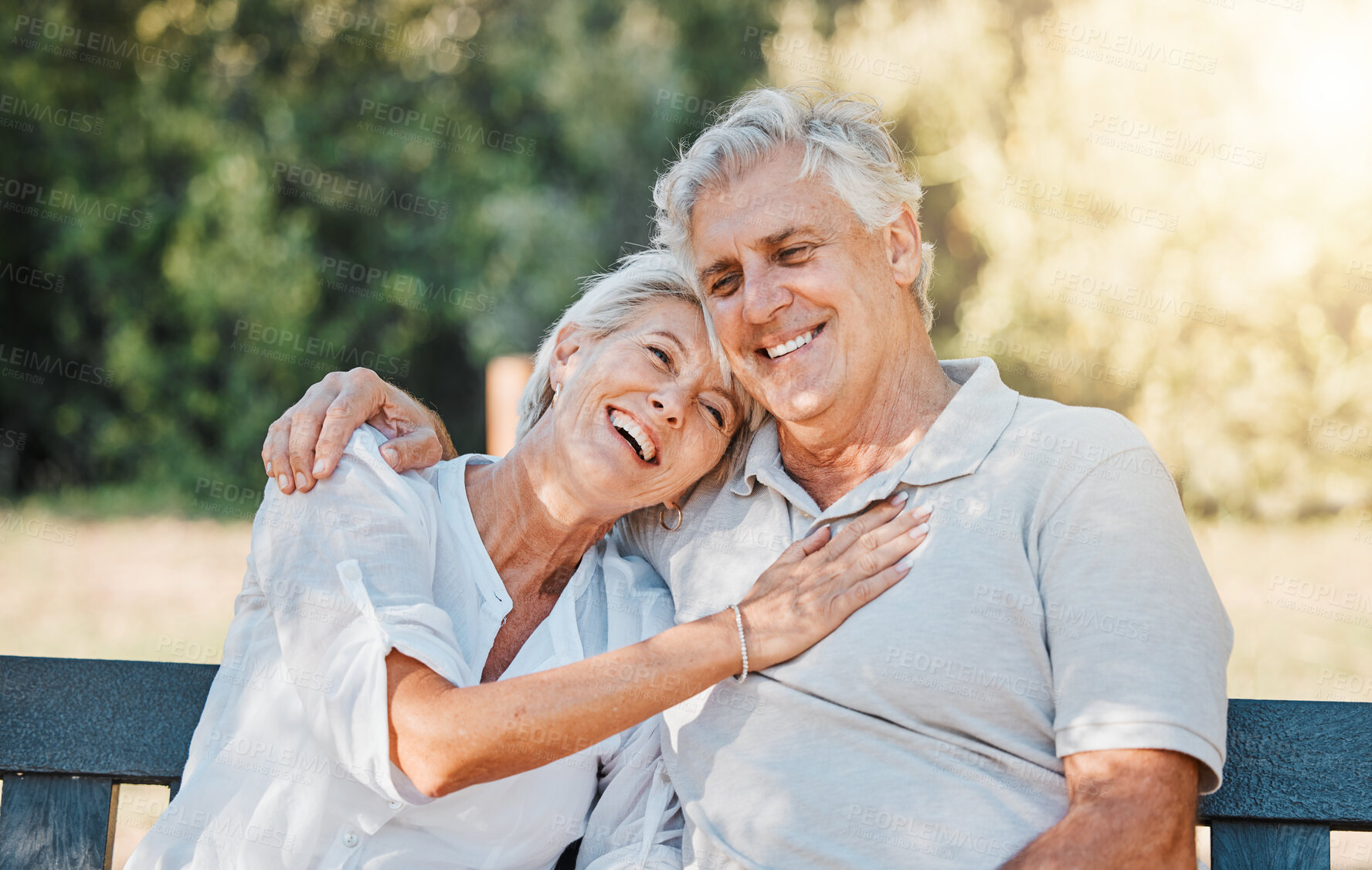 Buy stock photo Senior happy couple, laughing or park bench in nature garden for love, support or bonding retirement trust. Smile, relax or elderly man hugging woman in backyard with joke, funny news or relationship