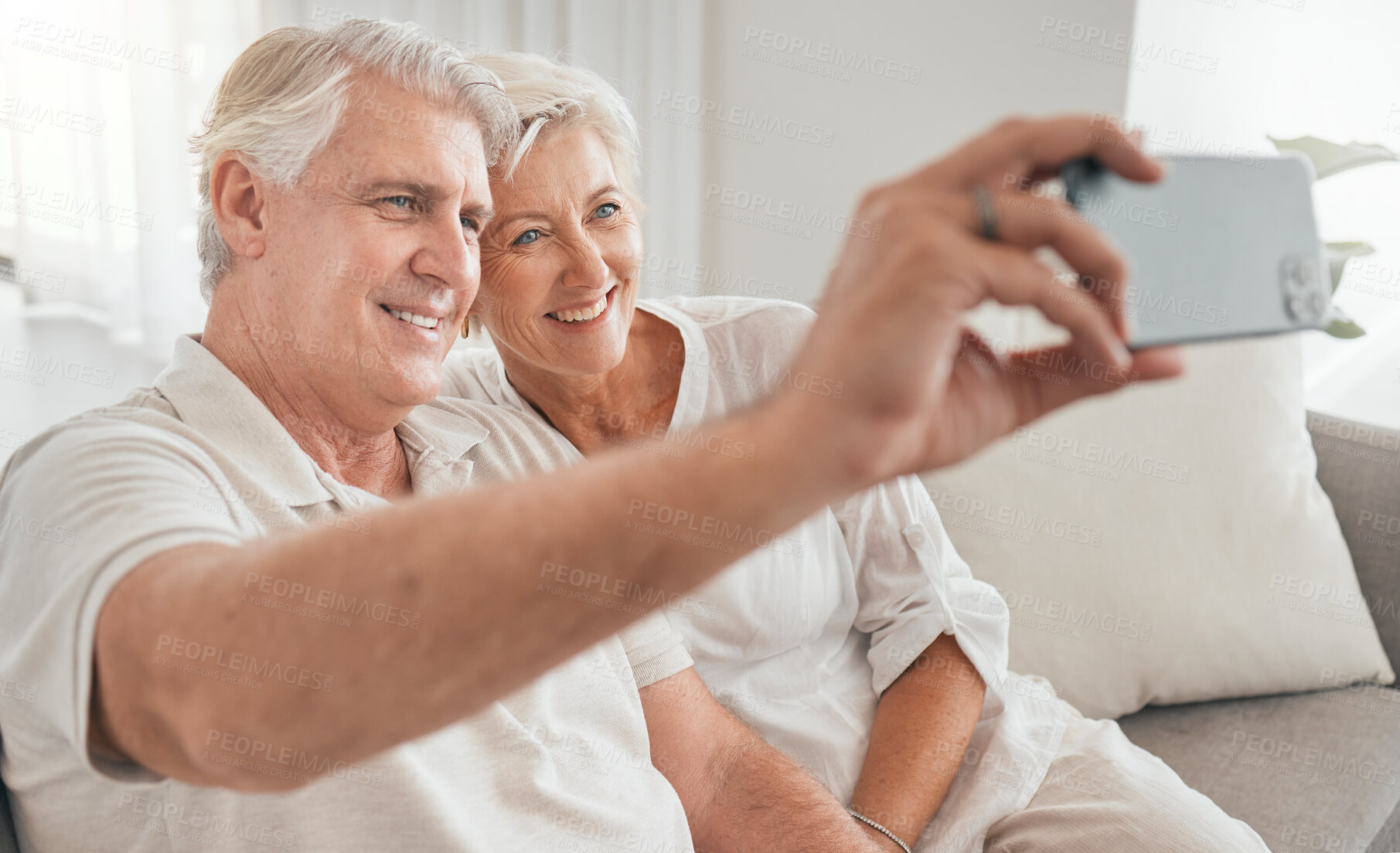 Buy stock photo Old couple, selfie and happy on sofa in home, living room or apartment in retirement with post on social media. Mature, people and smile in profile picture, live stream or video call with smartphone