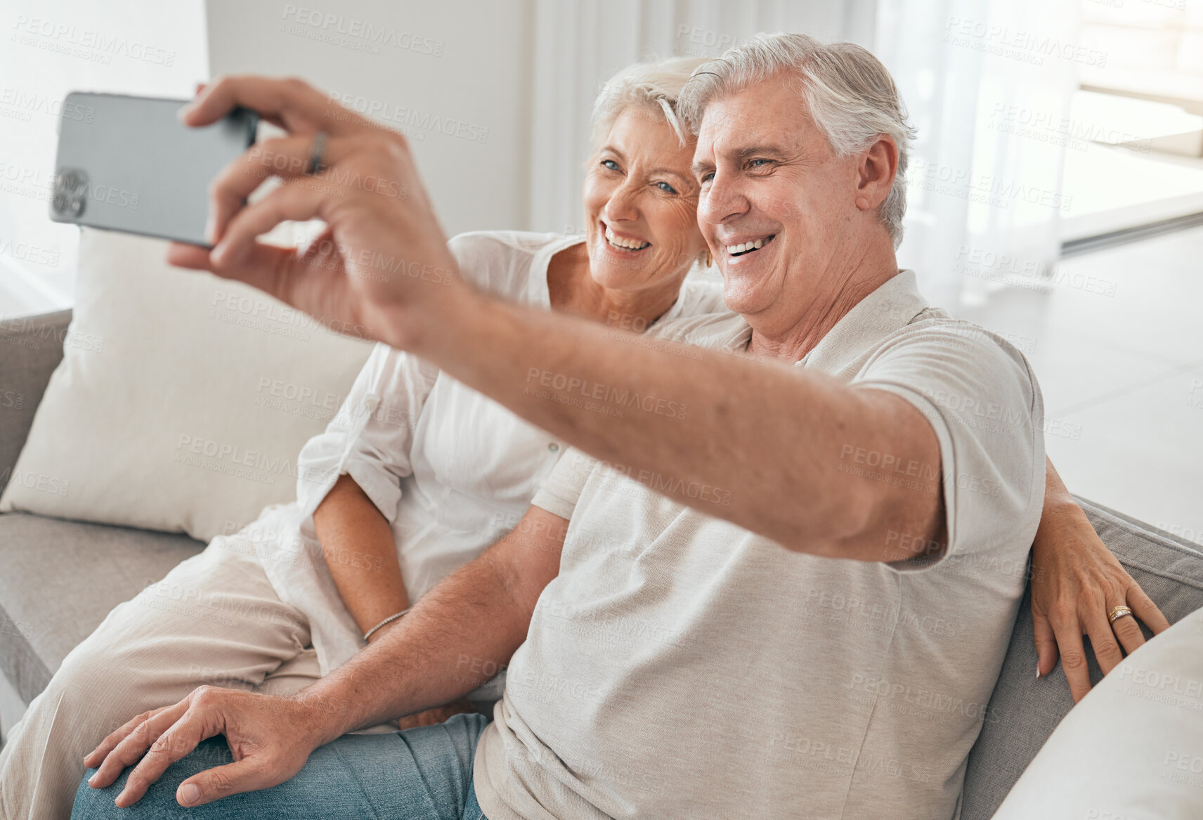 Buy stock photo Happy, old couple and selfie on sofa in home, living room or apartment in retirement with post on social media. Mature, people and smile in profile picture, live stream or video call with smartphone