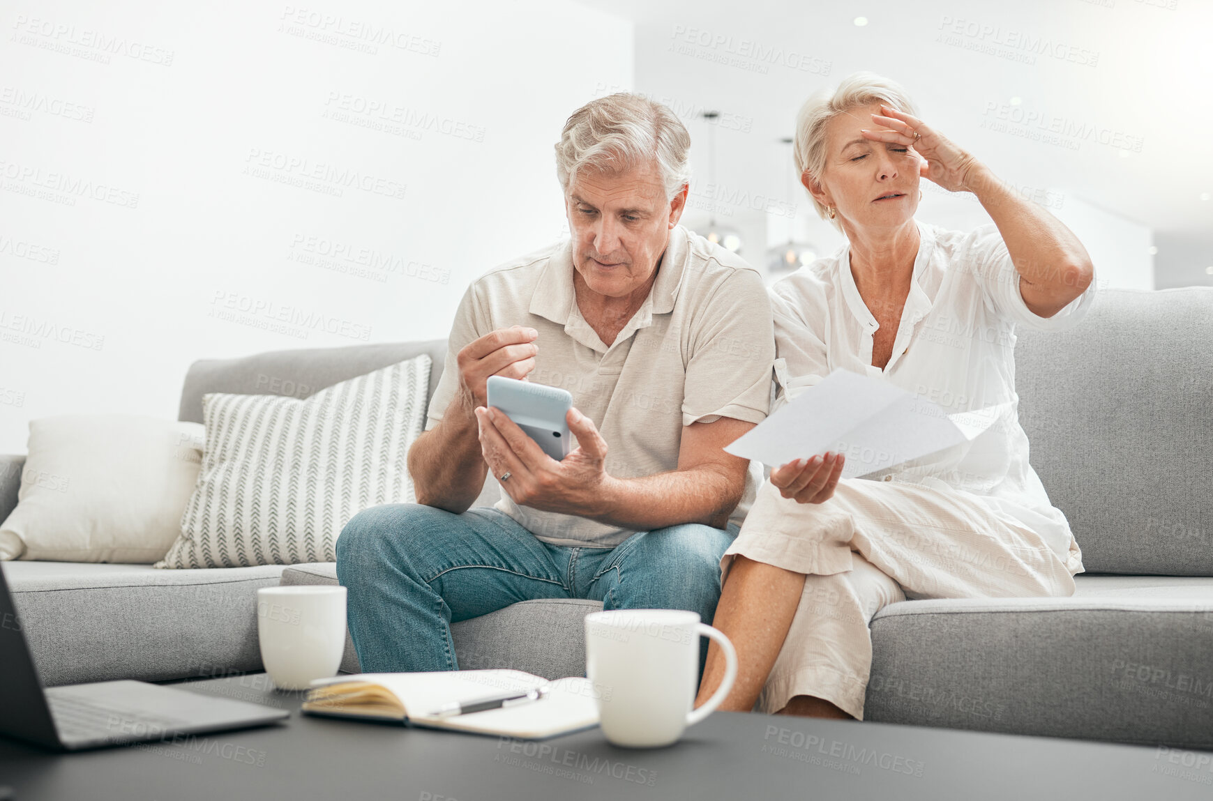 Buy stock photo Frustrated senior couple, documents and debt on living room sofa in financial crisis, expenses or bills at home. Mature man and woman checking finance, paperwork or budget with calculator for invoice