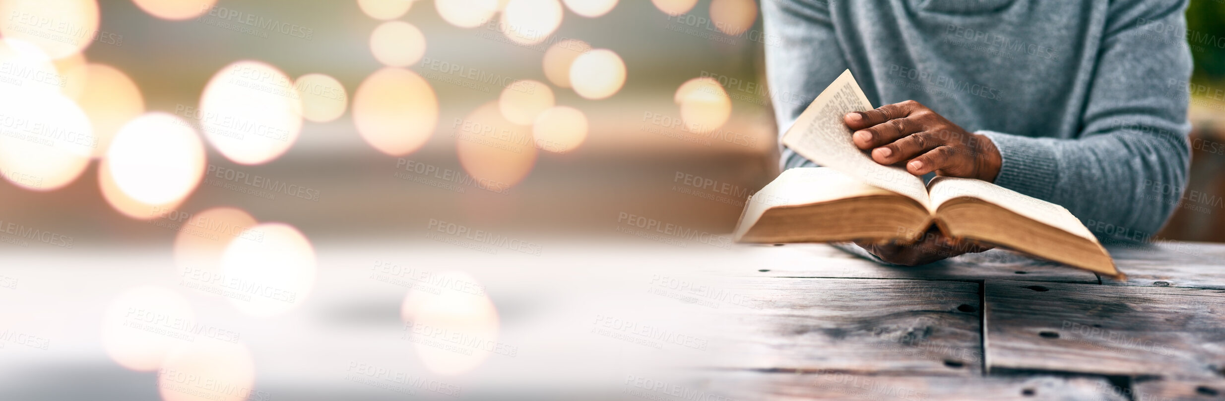 Buy stock photo Banner, hands and person reading book on space, mockup and bokeh table for bible study, religion and spiritual education. Novel, literature and information for research, prayer and gospel learning