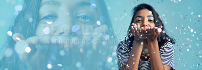 Buy stock photo Blowing glitter, woman and portrait with double exposure and sparkle in a studio with celebration. Blue background, female person and confetti with modern fashion, surprise and silver decoration