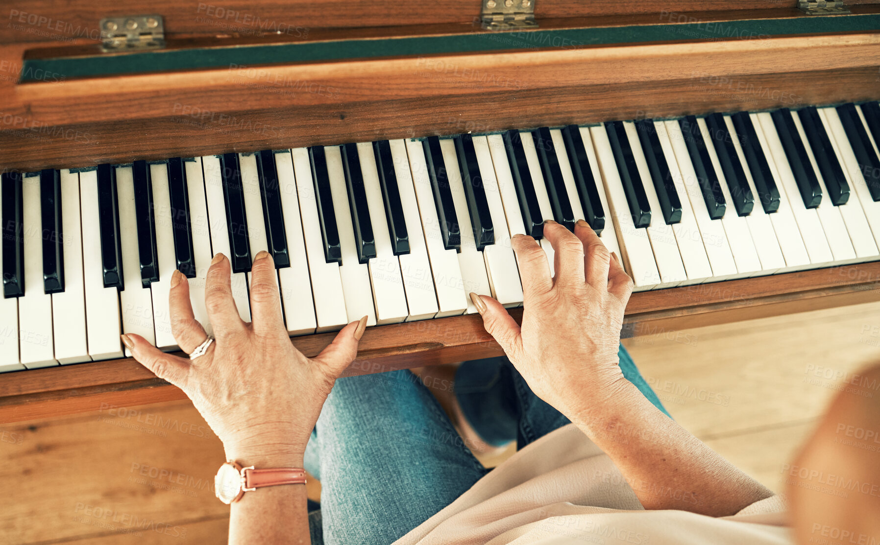 Buy stock photo Hands, piano and senior woman playing for music in living room for musical entertainment practice. Instrument, hobby and elderly female person in retirement enjoying a song on keyboard at modern home