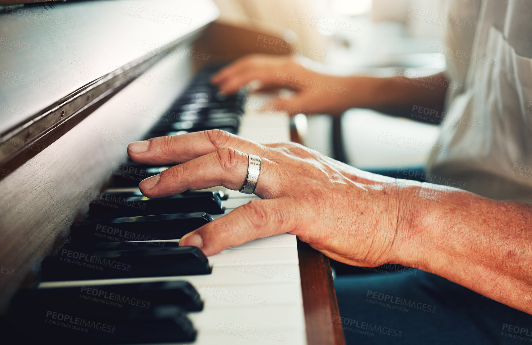 Buy stock photo Hands, piano and senior man playing for music in living room for musical entertainment practice. Instrument, hobby and elderly male person in retirement enjoying a song on keyboard at modern home.