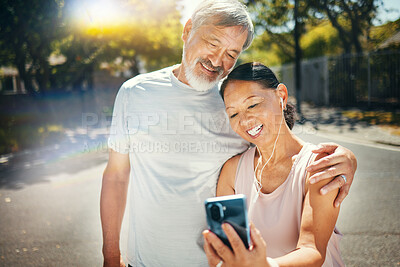 Buy stock photo Couple, smile and break from run for social media, meme and funny joke in street, humor and comedy. Happy senior people, retirement and fitness for health, laughing and earphones for smartphone