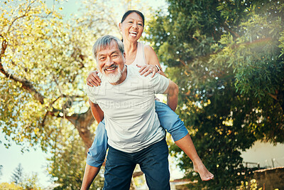 Buy stock photo Piggy back, portrait and Asian couple in garden for bonding, healthy relationship and relaxing outdoors. Marriage, nature and senior man and woman happy, laughing and playful for love, care and fun