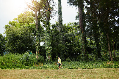 Buy stock photo Senior man, exercise walk and forest in profile, adventure and outdoor for wellness in retirement. Mature person, fitness or workout for health, hiking or freedom in woods, countryside or nature park