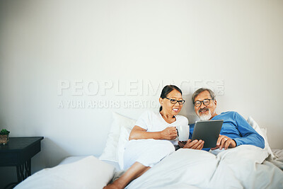 Buy stock photo Tablet, senior or happy couple in bed on social media for communication on website or internet. People, bedroom or mature woman watching movie with an Asian man online streaming on technology at home