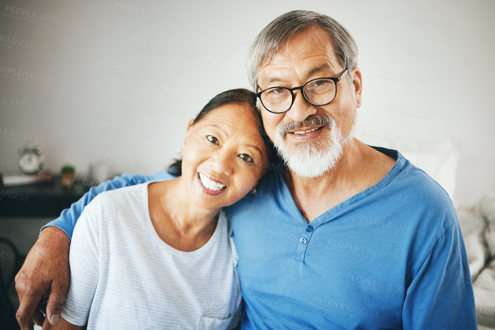 Buy stock photo Mature, portrait or happy couple hug in home or house together to relax on holiday with bond or support. Embrace, lovers or romantic Asian man with a senior woman with love, smile or care in marriage