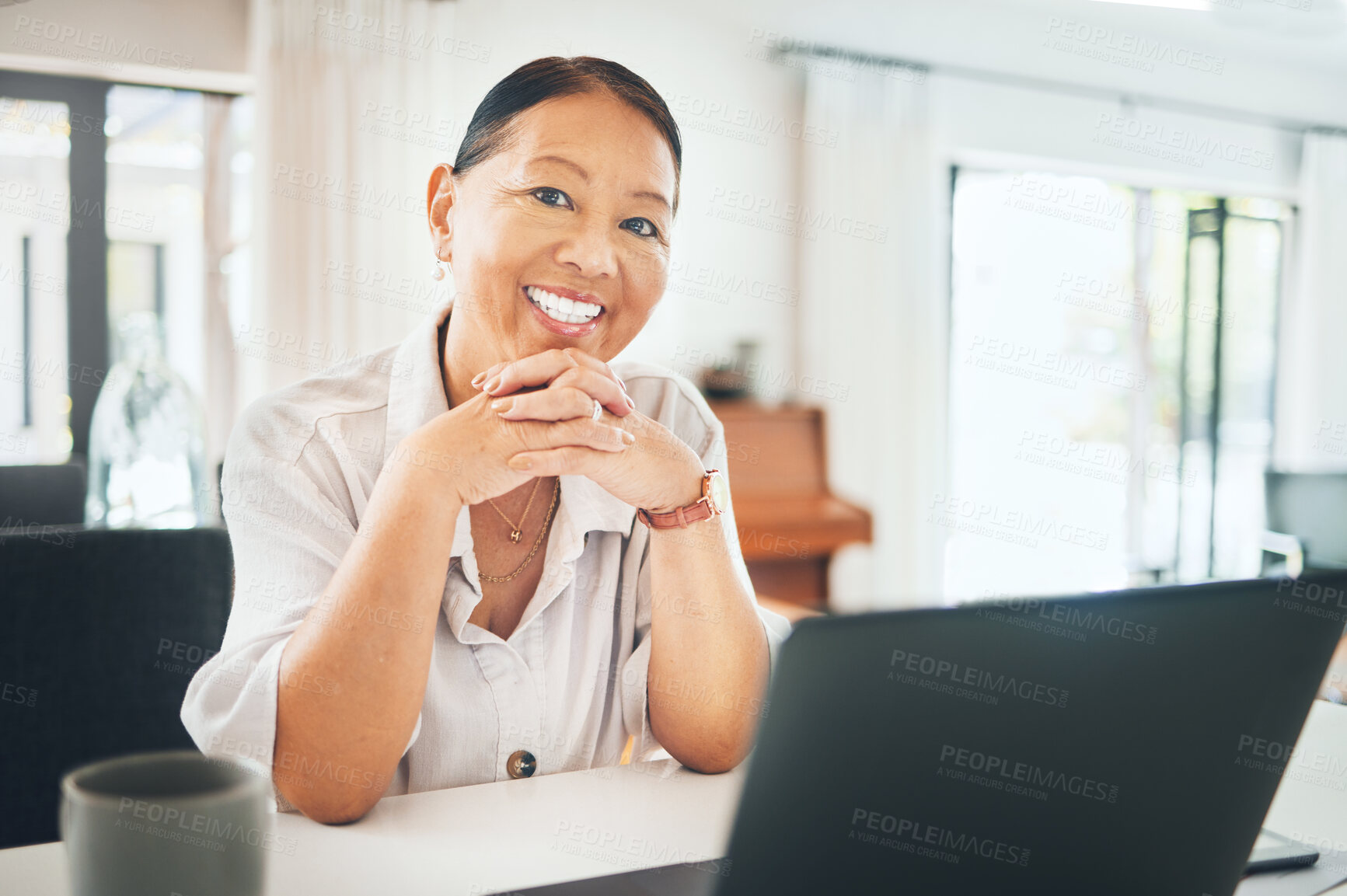 Buy stock photo Mature woman, portrait and happy on laptop for home investment, asset management or pension research. Face of Asian person on computer in kitchen for morning email, registration or financial planning