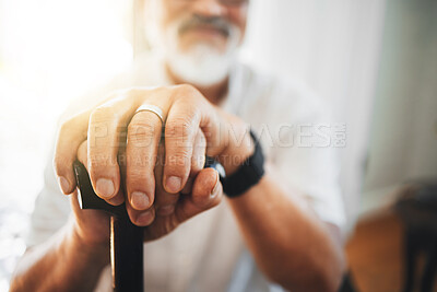 Buy stock photo Hands, walking stick and elderly man in home for support, healthcare or help in retirement. Closeup, lonely senior with disability and aid of cane for parkinson, arthritis or rehabilitation of stroke