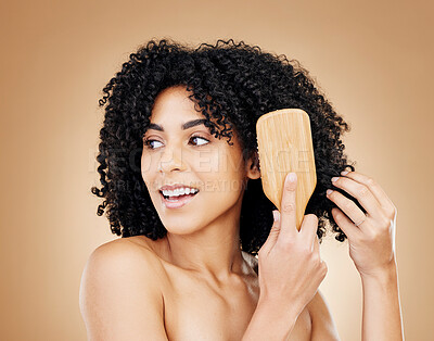 Buy stock photo Hair, woman brush curls and beauty, routine or treatment for shine, cosmetic care and smile on studio background. Wellness, haircare and growth with strong texture and bamboo tools, volume and afro