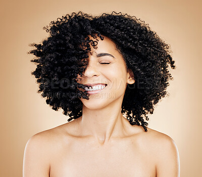 Buy stock photo Happy woman, curly or afro hair wind on fun studio background for healthy hairstyle growth, texture or frizz treatment. African beauty model, shake energy and change by shampoo transformation results