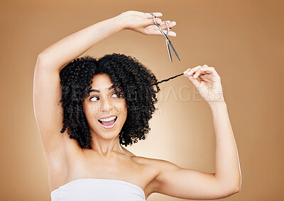 Buy stock photo Cutting, hair care and woman with scissors, smile and excited on a brown studio background. Person, happy girl and model with afro, curly and wow with growth, mockup space and grooming with aesthetic