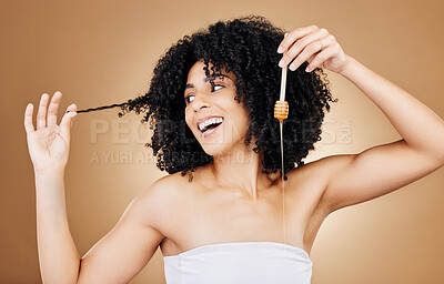 Buy stock photo Honey, hair and beauty portrait of woman with natural, care and oil treatment on studio background with happiness. Happy, African haircare and product with honeycomb moisture and sugar benefits