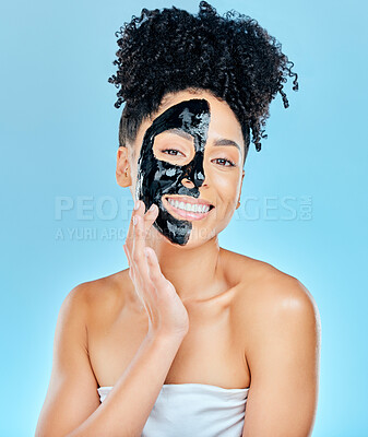 Buy stock photo Skincare, charcoal face mask and portrait of woman for facial treatment, anti aging and wellness. Beauty, studio and happy person with products for health, cosmetics or grooming on blue background