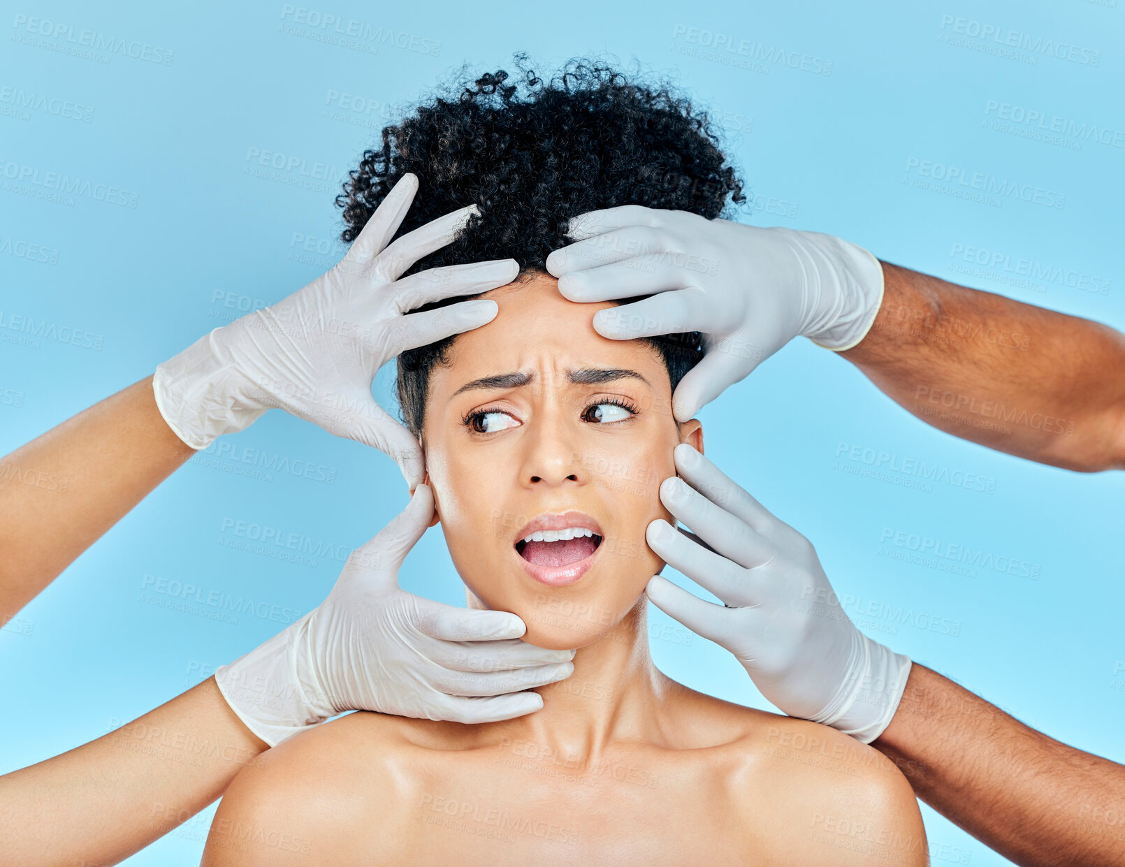 Buy stock photo Plastic surgery, facial and scared woman with hands on face in studio for skincare consultation. Model with stress, fear and anxiety for beauty, dermatology or collagen therapy on blue background.