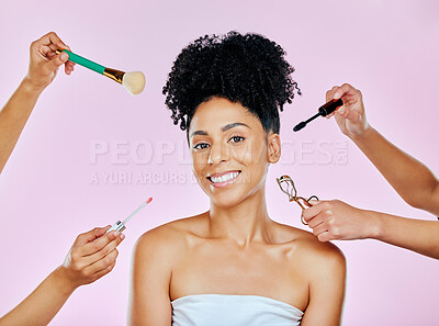 Buy stock photo Hands, portrait and a woman with makeup, tools and help on a pink background. Happy, skincare and a model or girl with people for cosmetics work, glow and facial beauty with a smile and artists