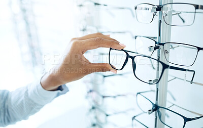 Buy stock photo Optometry store, eyeglasses and hands of person shopping for lens frame decision, retail product or prescription eyewear. Eye care, optical eyesight accessory and closeup customer choice for glasses