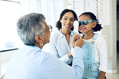 Buy stock photo Eye exam, optometry and child with senior woman optometrist at clinic for vision check. Eyesight, glasses and kid consulting old lady ophthalmologist for optics, analysis or prescription spectacles