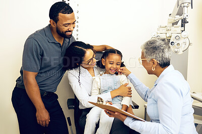 Buy stock photo Family, consulting and eye care with a woman optician in a clinic to see a patient for vision assessment. Mother, father and daughter at the optometrist for an appointment to test eyesight for kids