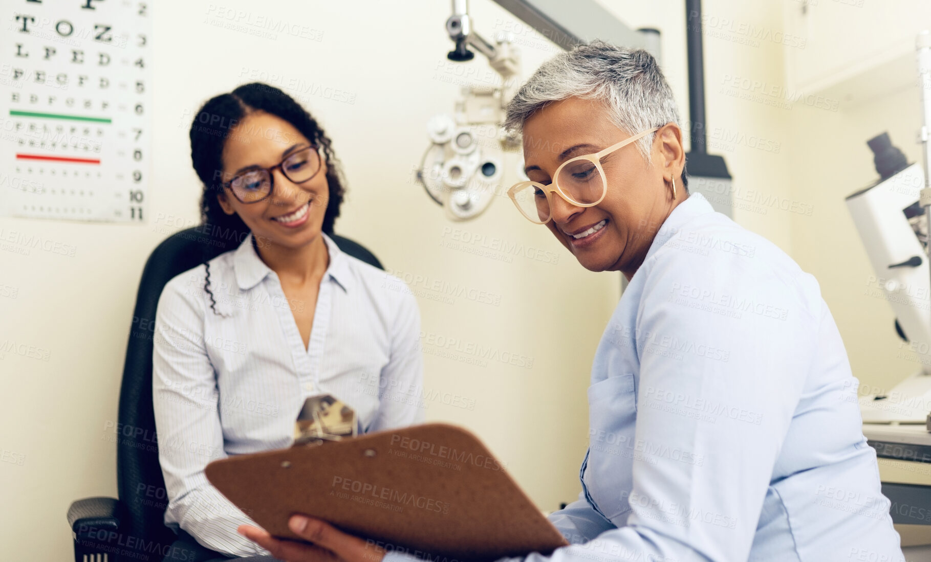 Buy stock photo Optometrist, patient and eye exam, clipboard and health insurance paperwork, help and medical with eyecare. Wellness, contract or agreement with vision, assessment and women in clinic for optometry