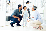 Optometrist, father and child for eye care, optometry or vision assessment or test in clinic or store. Man, senior woman or girl kid at optician for eyesight appointment for focus or glasses with joy