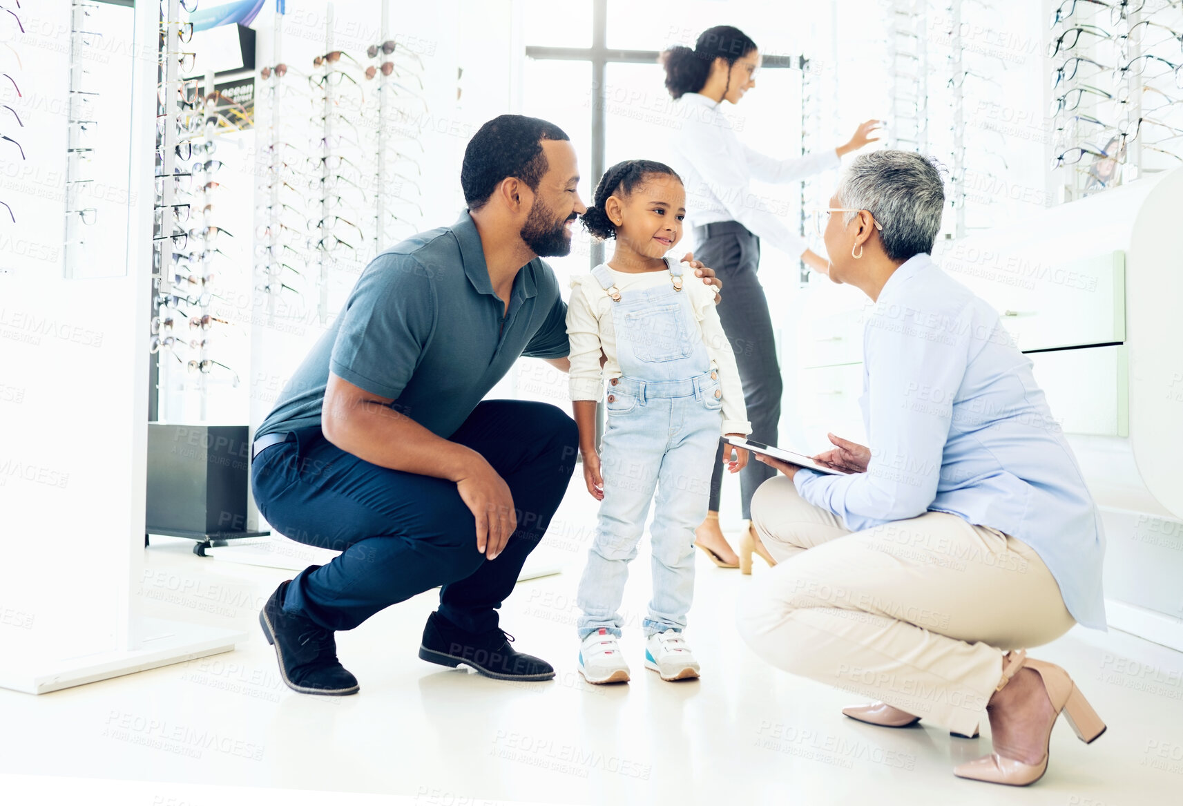 Buy stock photo Optometrist, father and child for eye care, optometry or vision assessment or test in clinic or store. Man, senior woman or girl kid at optician for eyesight appointment for focus or glasses with joy