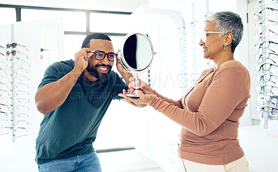 Buy stock photo Mirror, glasses and optometrist help happy man in store for choice of lens, frame and consultation. Smile, reflection and mature optician with patient for spectacles, healthy vision and ophthalmology