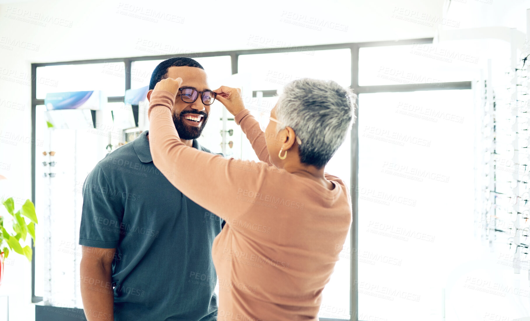 Buy stock photo Optometry, glasses and woman with client for decision, choice and options in optician store for vision. Healthcare, ophthalmology and people consulting and prescription lens, spectacles and frames