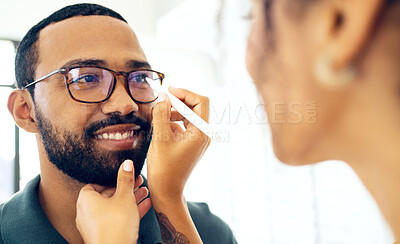 Buy stock photo Vision, glasses and eye test with a man at the optometrist for a prescription frame lens assessment. Face, smile and eyewear with a customer talking to a consultant at the optician for assistance