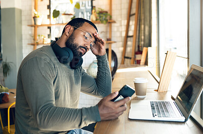 Buy stock photo Man, phone and stress in coffee shop for remote work, job search or bad news of financial fail, debt or loan. African freelancer with headache, worry or reading on mobile, business decision and cafe