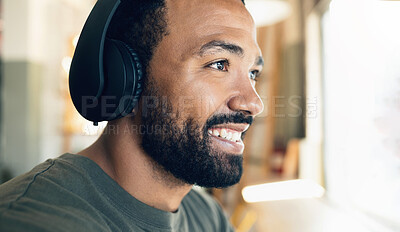 Buy stock photo Face, smile and music with a man listening to audio in the living room of his home closeup. Headphones, radio and a happy young person having fun while streaming sound alone in his house to relax