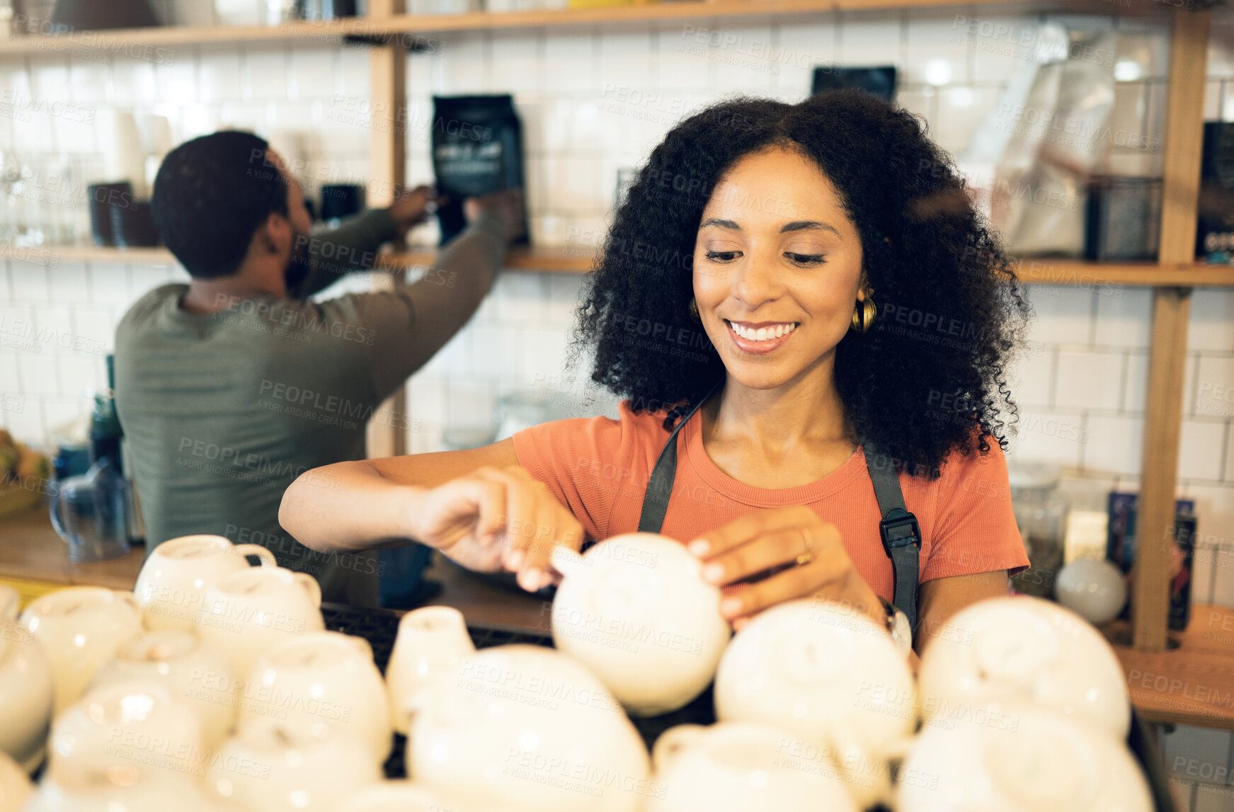 Buy stock photo Barista woman, coffee shop and cleaning cup with smile, packing and organized at small business, startup or store. Waitress woman, man and happy in restaurant, cafe and shelf with work partnership