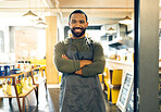 Happy man, portrait and small business owner of cafe with arms crossed in confidence or retail management. Male person, barista or waiter smile by entrance of coffee shop, store or ready for service