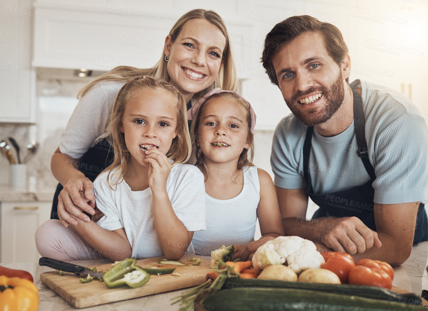 Buy stock photo Portrait, cooking and happy family in kitchen together for bonding and preparing dinner, lunch or supper. Love, smile and girl children cutting vegetables or ingredients with parents for meal at home