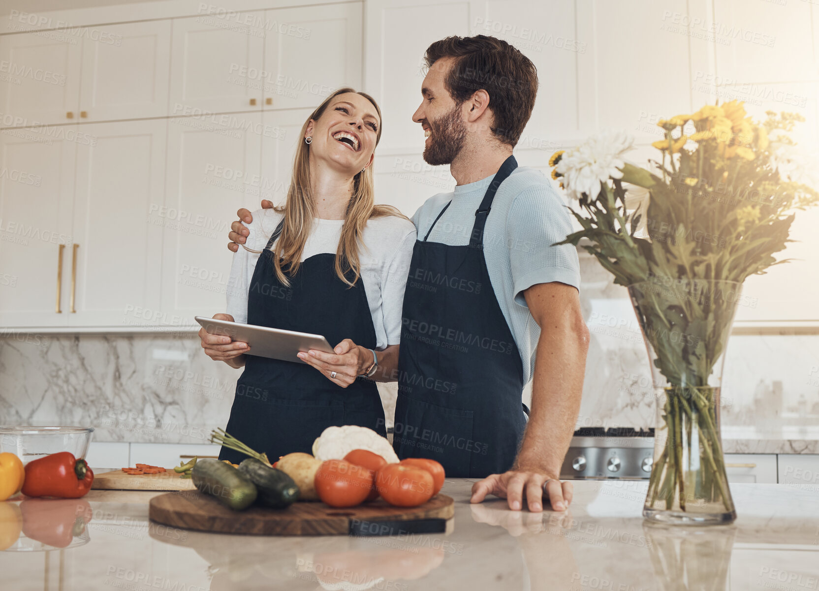 Buy stock photo Cooking, laughing or happy couple with tablet or food for a healthy vegan diet together at home. Smile, vegetables or funny woman in kitchen with love or man learning a dinner recipe on online blog