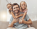 Portrait, hug and girl kids with father on a sofa with love, bond and fun at home together. Happy family, face and children embrace parent in a living room with care, trust and support in a house