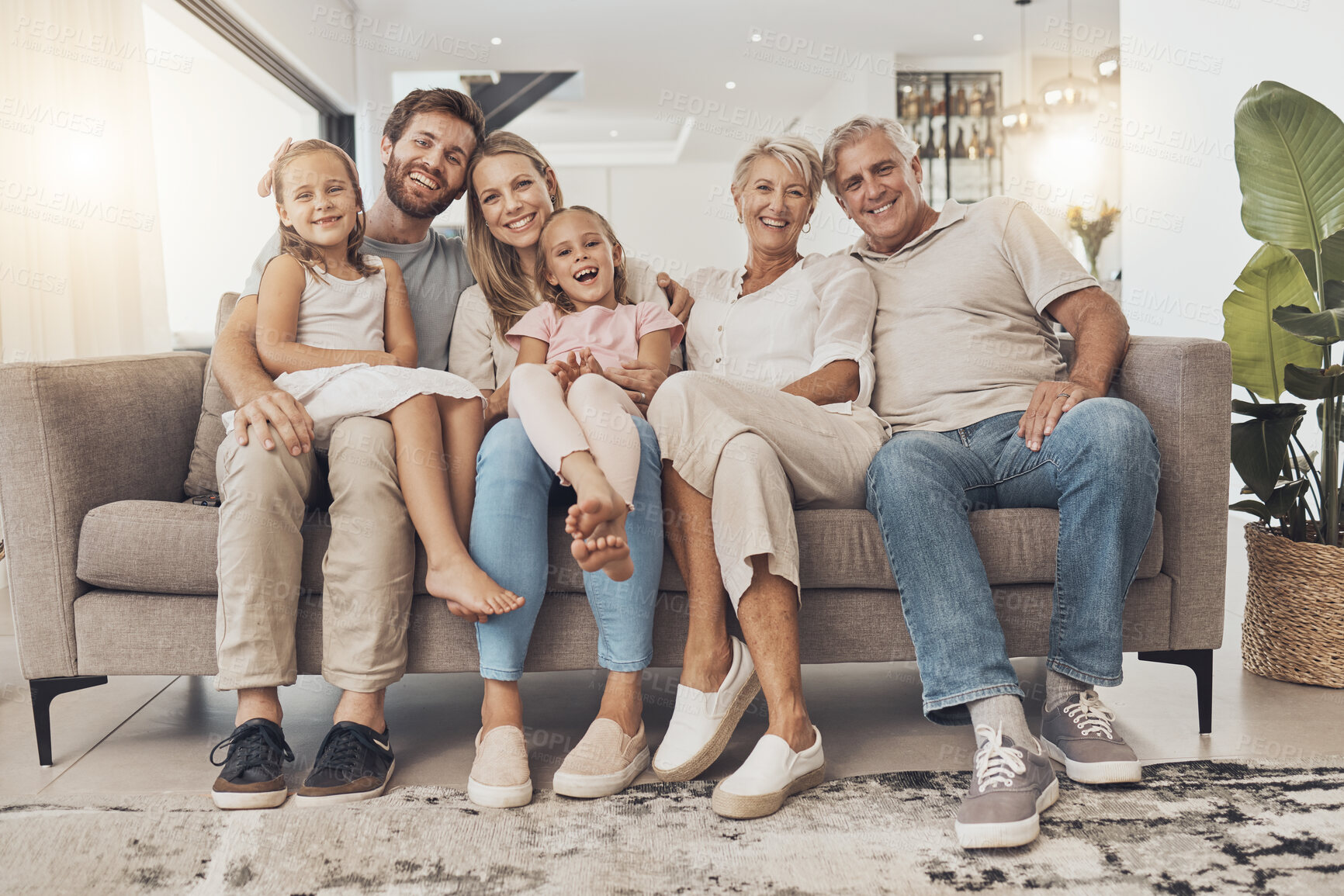 Buy stock photo Big family, happy and portrait in home living room, support and bonding together. Parents, grandparents and kids smile on sofa for connection, love children and care in healthy relationship in house