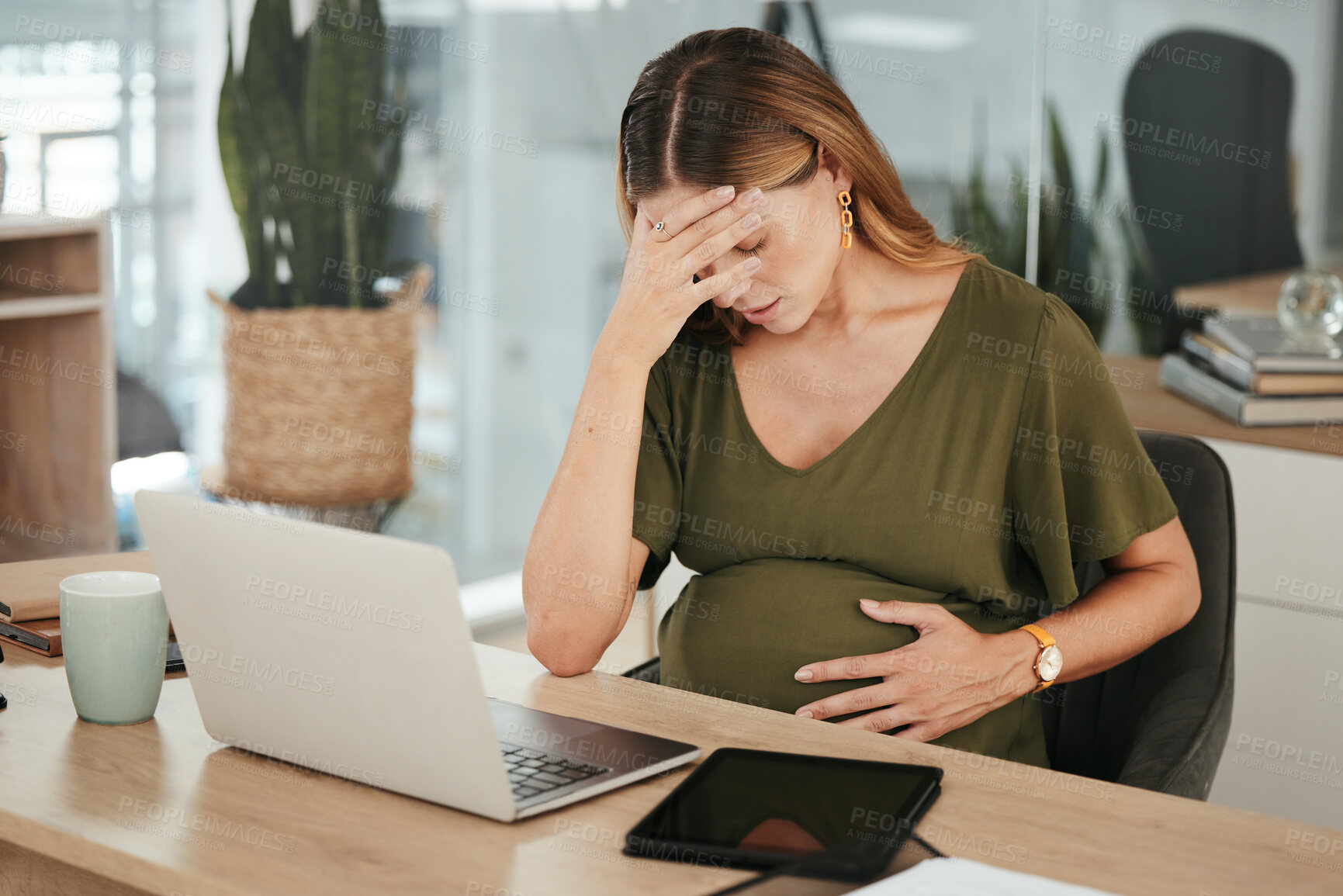 Buy stock photo Woman, office and pregnant with stress, headache and laptop at work, burnout and workplace. Maternity, employee and pregnancy with hand on stomach, pain and tired for baby, working and healthcare