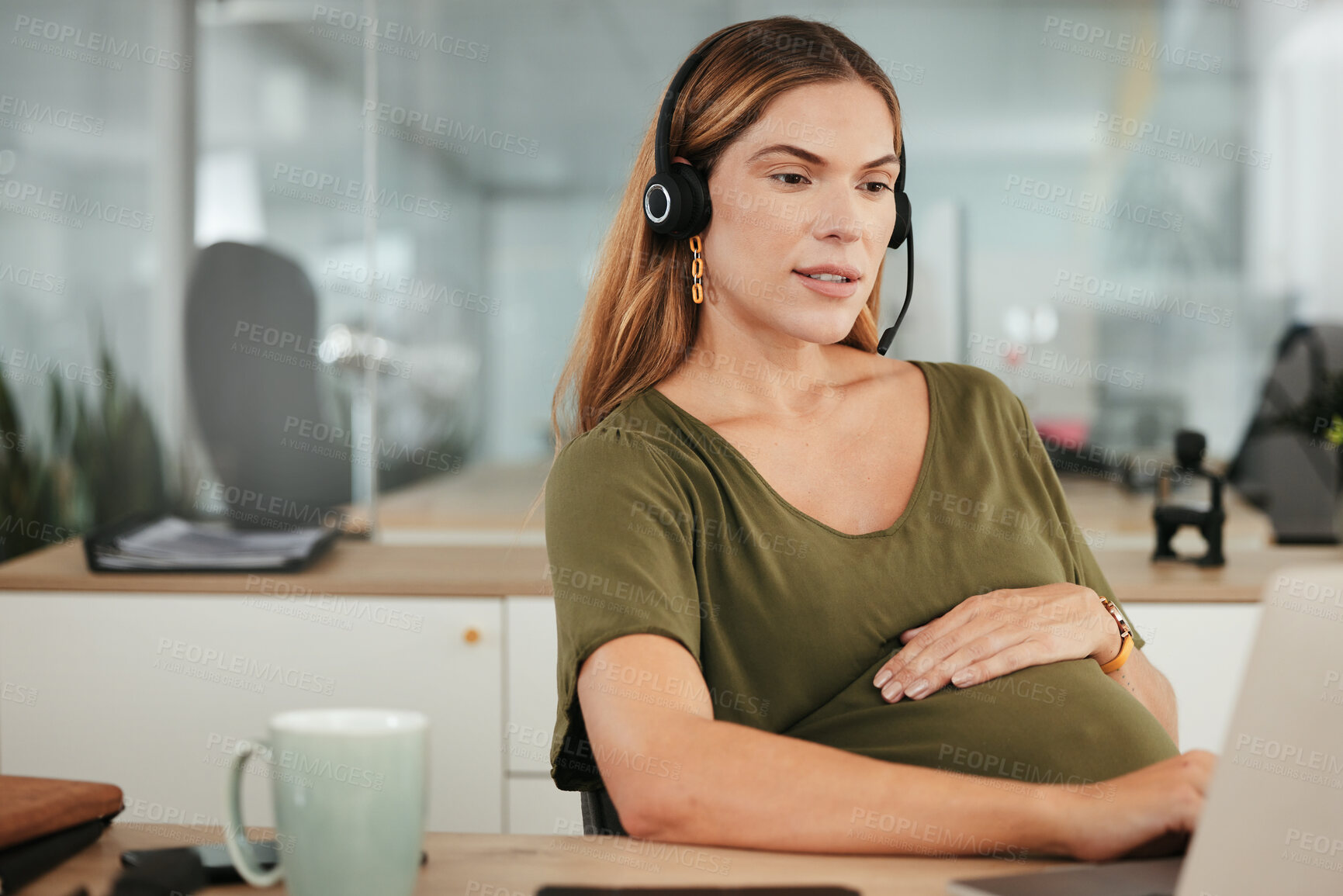 Buy stock photo Pregnant, woman and work in call center, office and hands on stomach in telemarketing workplace. Consultant, pregnancy and working in company or planning maternity for health and wellness in business