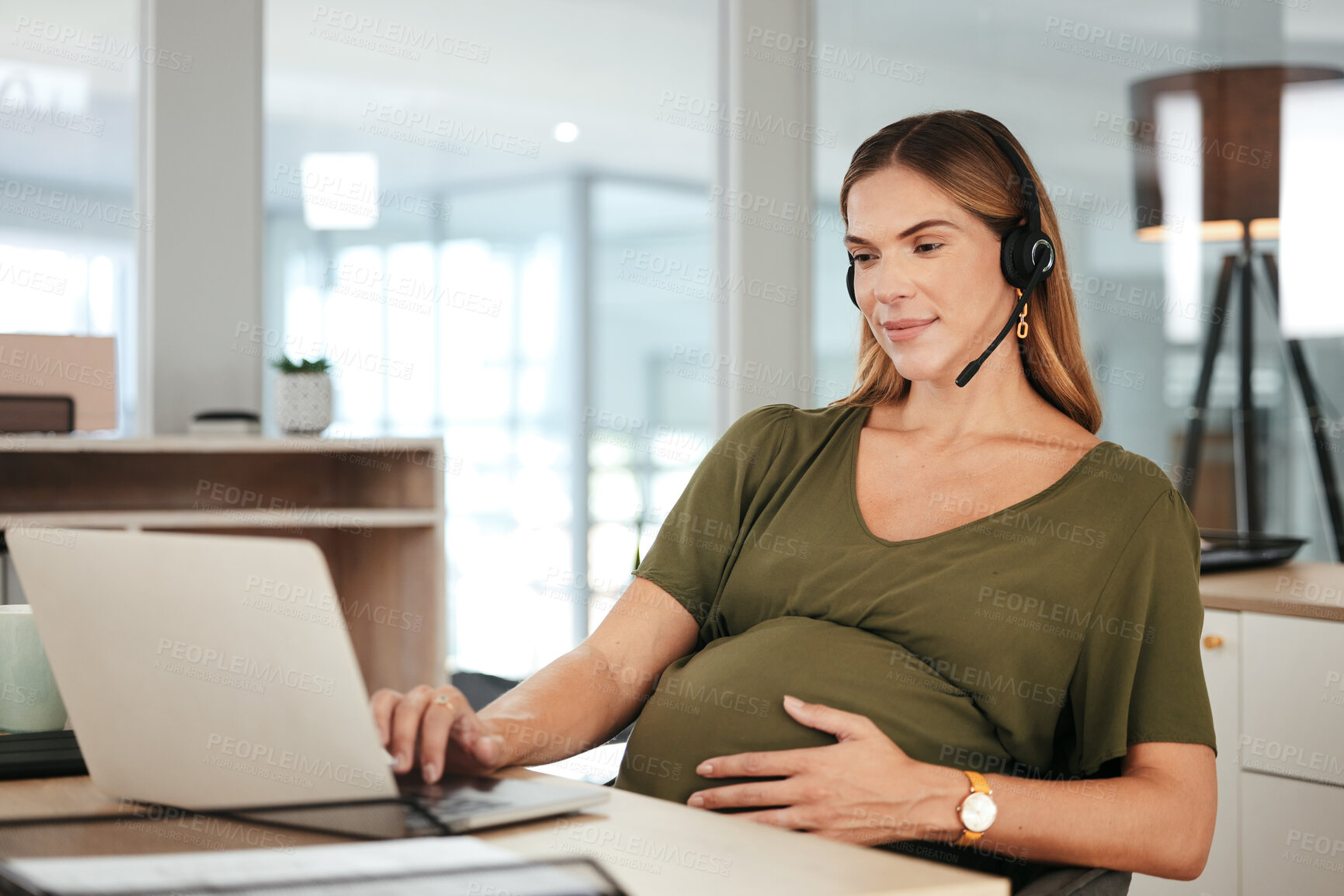 Buy stock photo Pregnant, woman and work in call center, office and hands on stomach in telemarketing workplace. Consultant, pregnancy and working in company or planning maternity for health and wellness in business