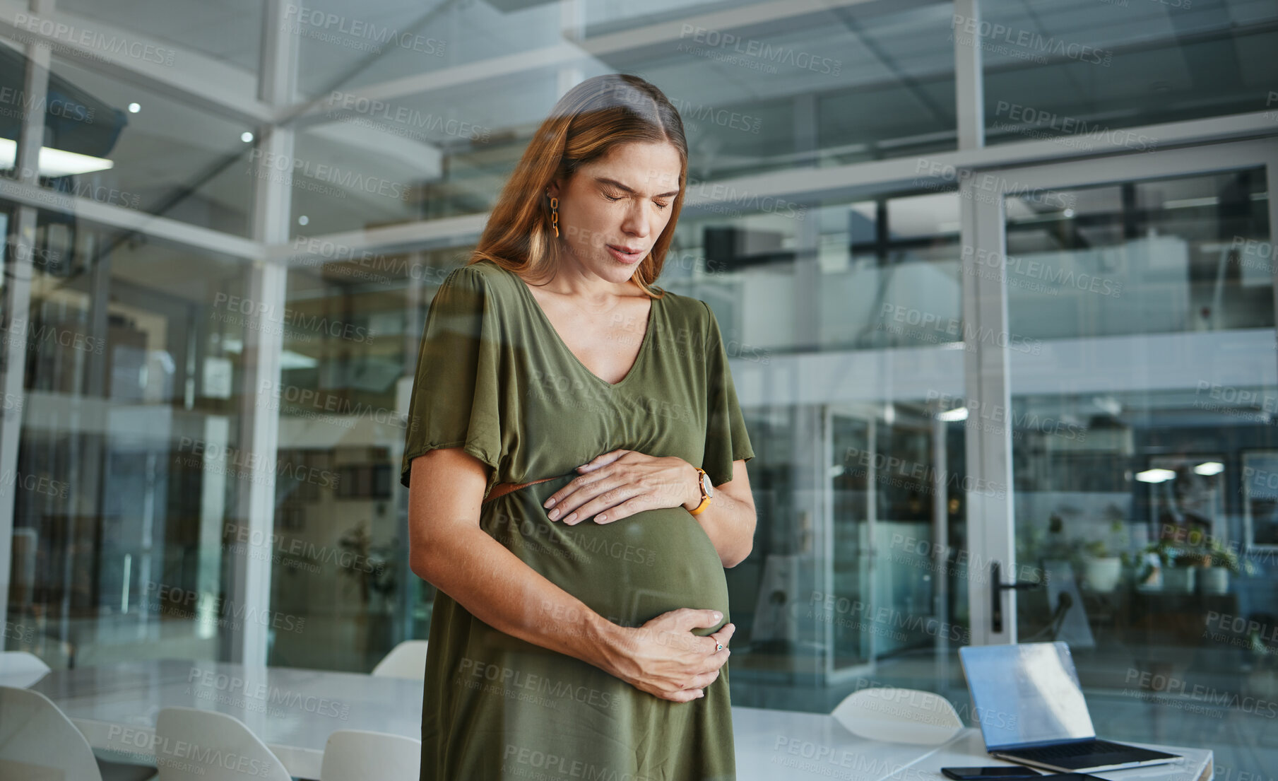 Buy stock photo Pregnancy, pain and business woman in office with contractions or muscle tension in startup company. Pregnant, discomfort and professional touch abdomen, strain and fatigue of mother in workplace