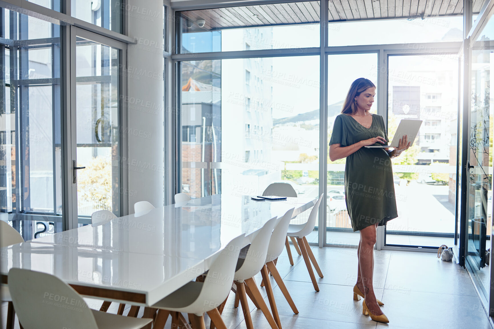 Buy stock photo Laptop, research and business with a pregnant woman in the boardroom, planning for her maternity leave. Computer, email and pregnancy with a young professional employee in the workplace as a mother