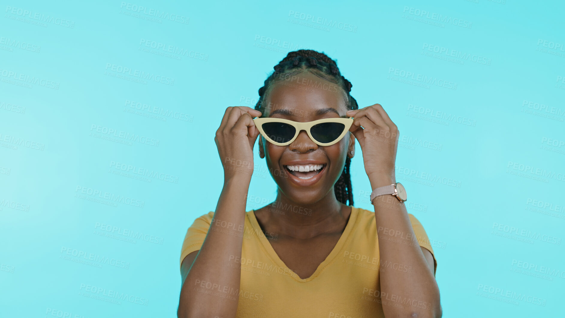 Buy stock photo Face, happiness and black woman with glasses, silly or cheerful girl on a blue studio background. Portrait, African person or model with funky eyewear, trendy or goofy with casual outfit or happiness