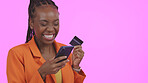 Business woman, phone and credit card for online shopping, e commerce sale or fintech payment in studio. Excited African person or winner for mobile banking, transaction or order on a pink background