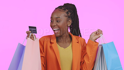 Buy stock photo Woman, credit card and shopping bag with wow for fashion payment, e commerce sale and discount in studio. Excited customer or african winner for banking, debit and clothes or gift on pink background