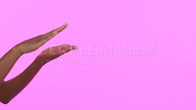 Buy stock photo Hands, skincare and mockup with a person on a pink background in studio for advertising or marketing. Beauty, banner and space with a model closeup on a color wall for a salon or spa success